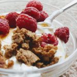 delicious greek yogurt with biscuit crumb and fresh raspberries
