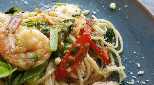 shrimp pasta served on gray plate