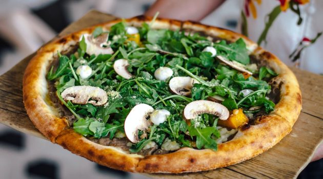pizza with mushrooms and arugula