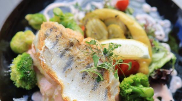 fish with sauce and vegetables