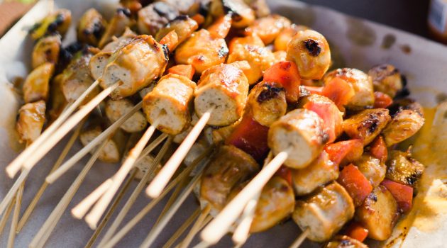 bunch of grilled meat skewers