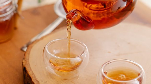 pouring tea into glass