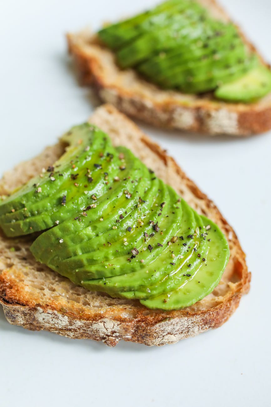 close up photo of sliced bread with avocado